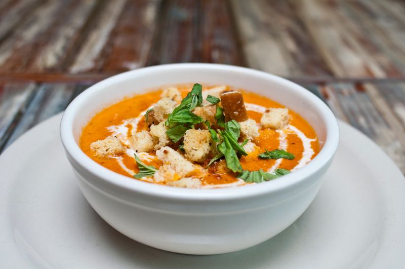 Creamy tomato basil soup with fresh herbs